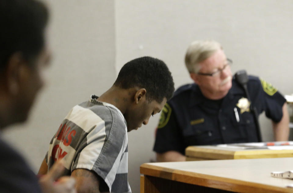 Sir Young, 20, sits in court before a hearing in Dallas Thursday, May 8, 2014. A district court judge has reversed a previous order and imposed a series of probationary requirements for the 20-year-old man convicted of raping a schoolmate. The initial punishment for Young sparked a backlash when a prior judge in Dallas sentenced him to five years of probation and declined to impose standard conditions of probation for sex offenders. (AP Photo/LM Otero)