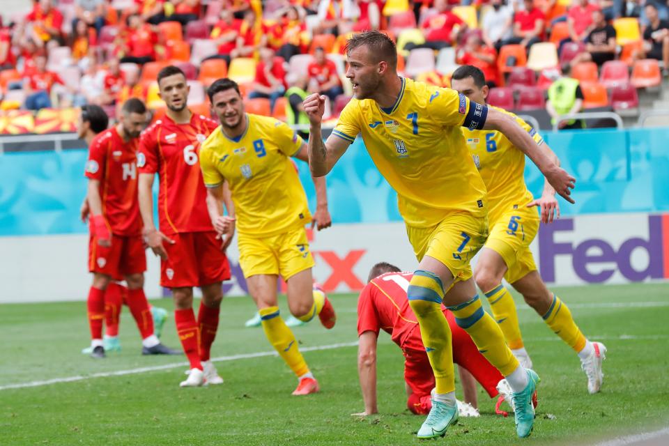 Andriy Yarmolenko celebrates after prodding Ukraine in front (Getty Images)