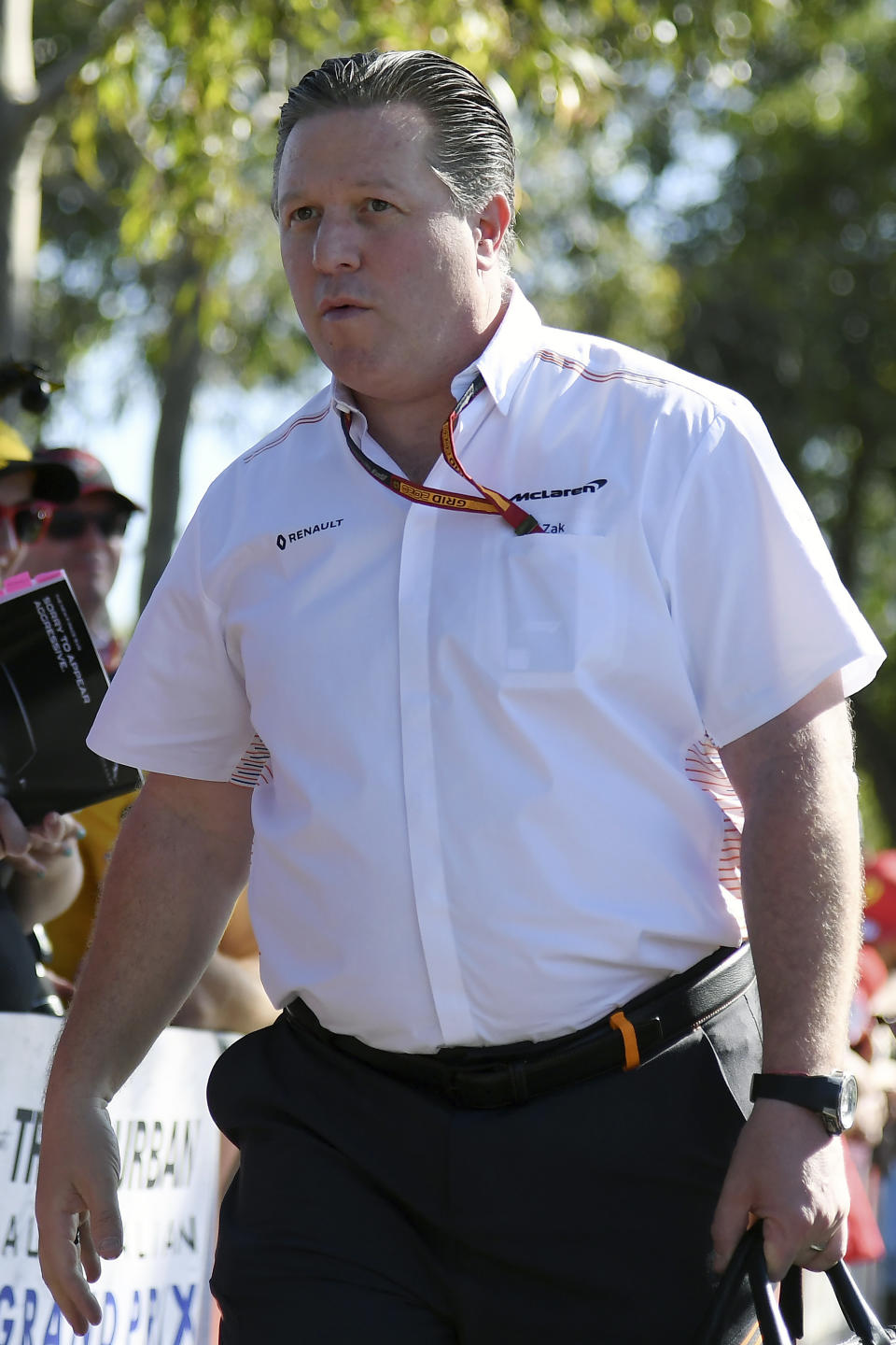 FILE - Zak Brown, CEO of McLaren, arrives at the track for the Australian Formula One Grand Prix in Melbourne, Thursday, March 12, 2020. There is no love lost between rival team owners Chip Ganassi and Zak Brown, and the two now find themselves entangled over the reigning IndyCar champion. Ganassi says he picked up the option on Alex Palou for 2023, but McLaren Racing says it has signed the Spaniard for next year. (AP Photo/Andy Brownbill, File)