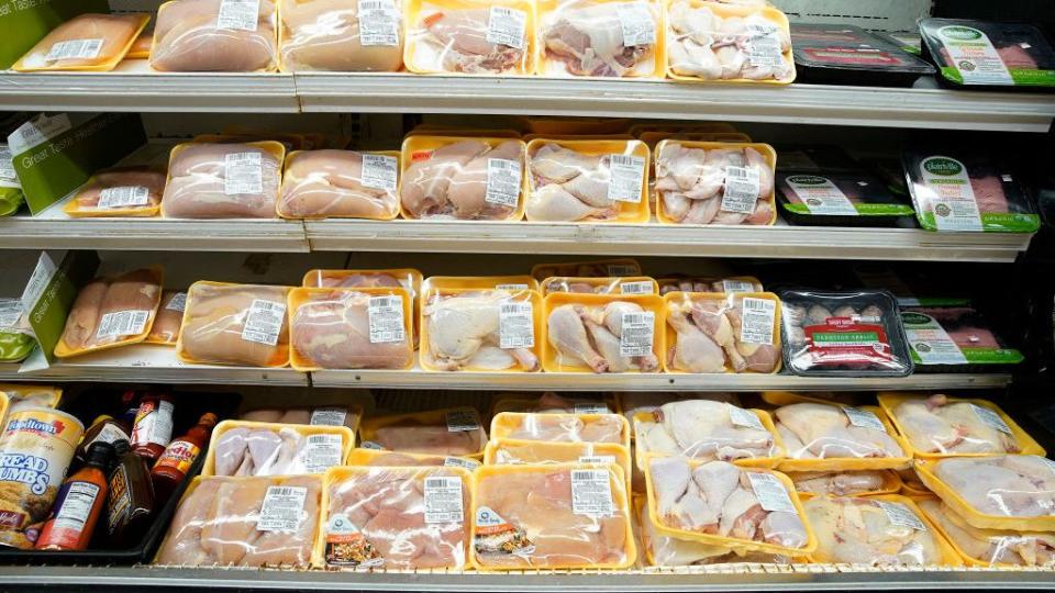 poultry packages are seen in a supermarket refrigerator in