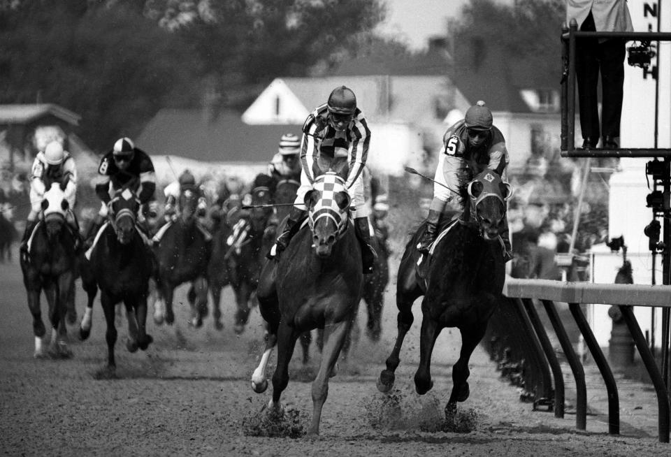 Ron Turcotte aboard Secretariat (left) edges ahead of Laffit Pincay Jr. aboard Sham (5) near the finish of the 99th Kentucky Derby at Churchill Downs.