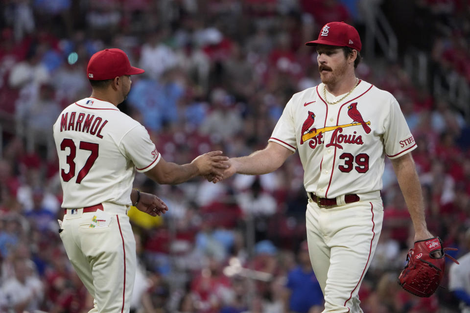 St. Louis Cardinals starting pitcher Miles Mikolas (39) is removed by manager Oliver Marmol (37) during the fifth inning of a baseball game against the New York Mets Saturday, Aug. 19, 2023, in St. Louis. (AP Photo/Jeff Roberson)