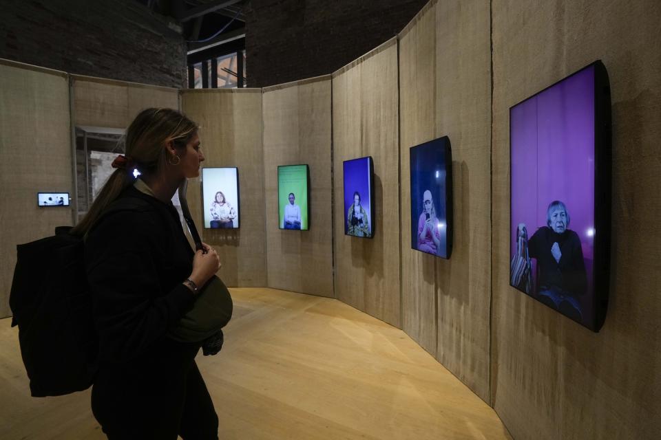 A visitor looks at the "New Making," installation at the Ukraine pavilion at the 60th Biennale of Arts exhibition in Venice, Italy, Tuesday, April 16, 2024. The Venice Biennale contemporary art exhibition opens Saturday for its six-month run through Nov. 26. (AP Photo/Luca Bruno)