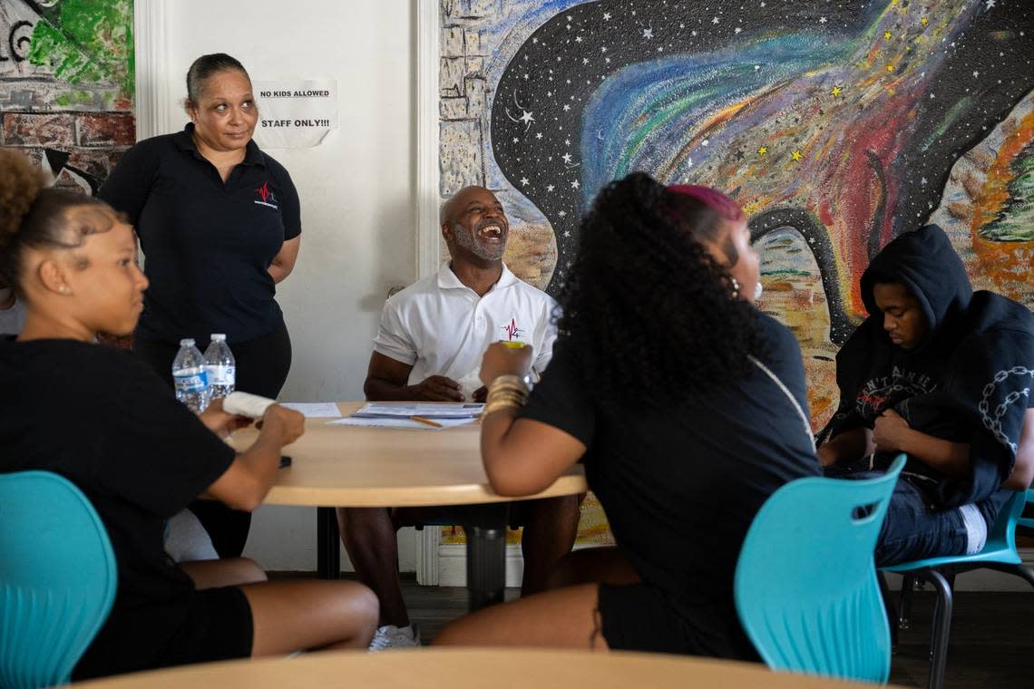 Motivational mentors Selvan Griggs and Kamisha Driver meet with Lavaiah Sevier, 13, Rayna Charleswell, 14, and Ralph Bledsoe, 18, during a life skills training classes at Movement4Life in south Sacramento last month. These classes cover topics such as communication skills, time management and the importance of voting.