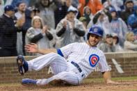 FILE PHOTO: Sep 28, 2018; Chicago, IL, USA; Chicago Cubs third baseman Tommy La Stella (2) slides into home plate to score against the St. Louis Cardinals during the eighth inning at Wrigley Field. Mandatory Credit: Patrick Gorski-USA TODAY Sports - 11333147