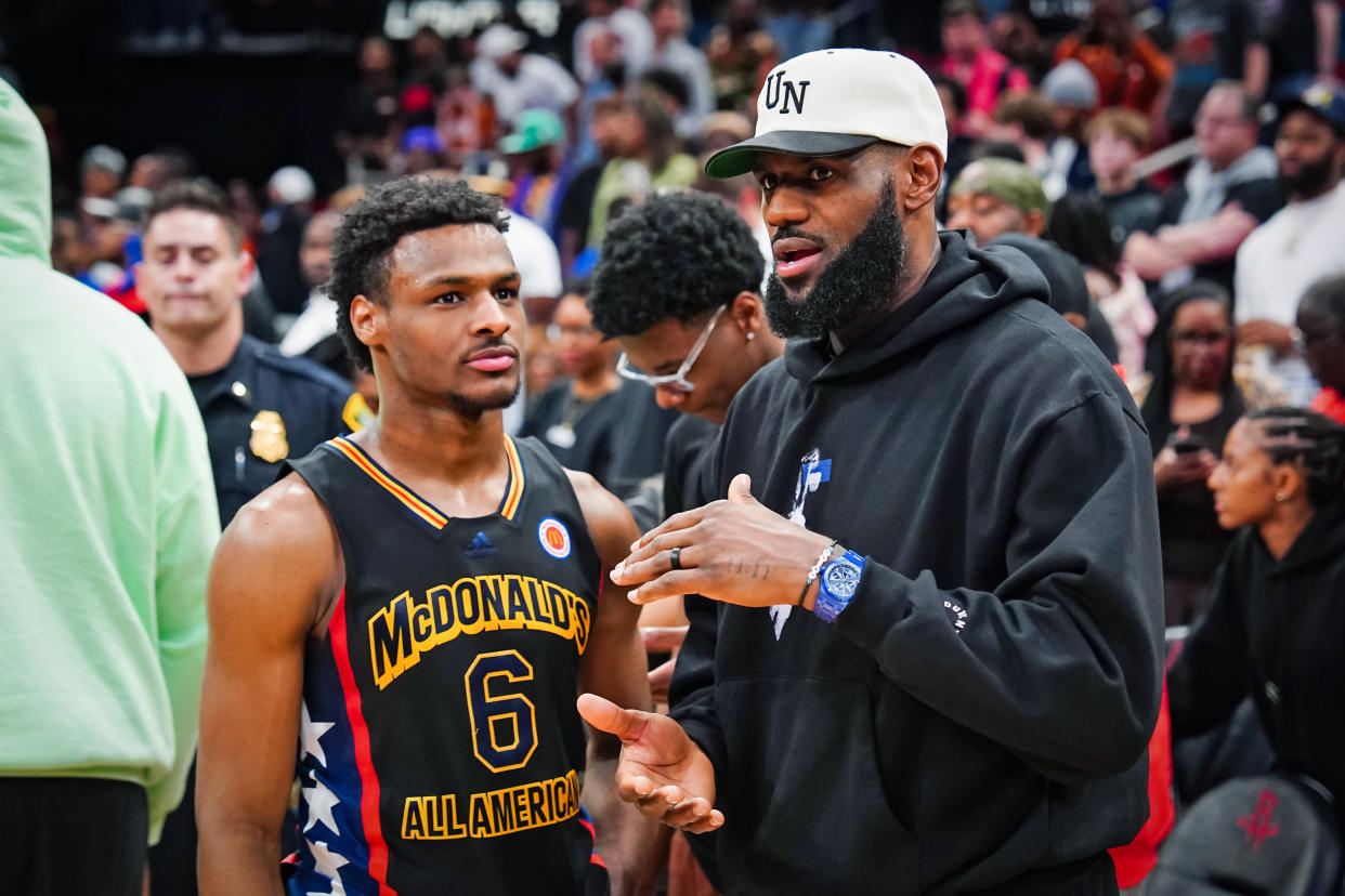 Bronny James talks with his father, Lebron James after the 2023 McDonald's High School Boys All-American Game on March 28. (Alex Bierens de Haan / Getty Images file)