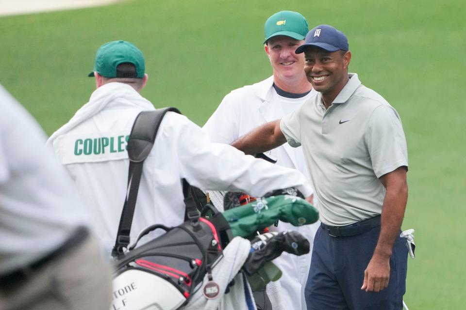 Apr 4, 2023; Augusta, Georgia, USA; Tiger Woods reacts after hitting an eagle from the fairway on no. 3 during a practice round for The Masters golf tournament at Augusta National Golf Club. Mandatory Credit: Danielle Parhizkaran-USA TODAY Network