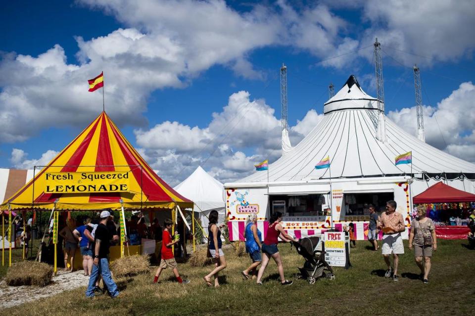 Festival-goers browse shops and activities during a past Hunsader Farms Pumpkin Festival in east Bradenton. The 32nd annual festival begins Oct. 14, 2023.