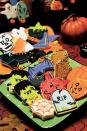 <p>Set out a platter of Frankenstein, bats, coffins, pumpkins, spiderwebs, and tombstone cookies, and watch them disappear.</p><p><em><strong><a href="https://www.womansday.com/food-recipes/food-drinks/a28861242/decorated-cookies-recipe/" rel="nofollow noopener" target="_blank" data-ylk="slk:Get the Decorated Cookies recipe.;elm:context_link;itc:0;sec:content-canvas" class="link ">Get the Decorated Cookies recipe.</a></strong></em></p>