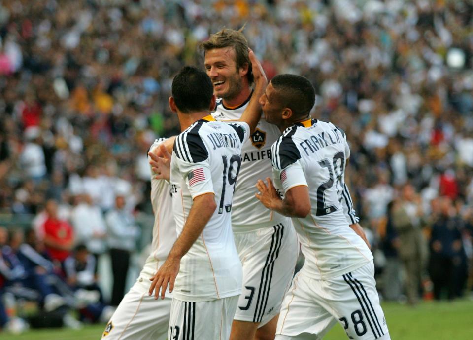 CARSON, CA - OCTOBER 03: David Beckham #23 of the Los Angeles Galay celebrates his first half goal with teammates Juninho #19 and Sean Franklin #28 in the first half during the MLS match against Chivas USA at The Home Depot Center on October 3, 2010 in Carson, California. (Photo by Victor Decolongon/Getty Images)