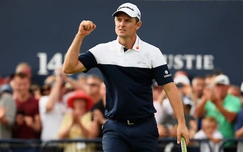 Justin Rose celebrates a birdie at the Open - Credit: Getty images