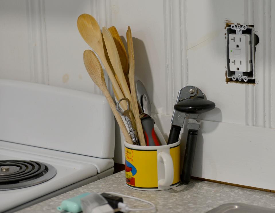 An electrical outlet remains uncovered near the stove in Liberty Lodge resident Howard Goldman's unit in Sandwich. Local veterans who are living at Liberty Lodge say their units are in disrepair.