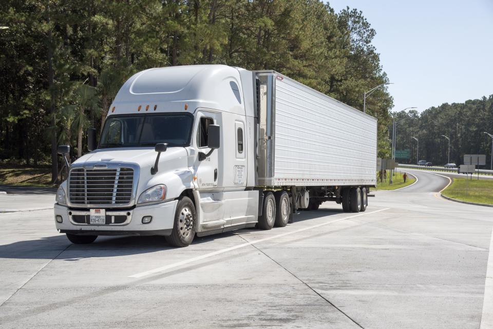 Tractor and trailer parked on a Highway rest stop area, Interstate 10 at Tallahassee Florida USA. (Photo by: Education Images/Universal Images Group via Getty Images)