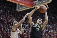 Purdue's Zach Edey (15) dunks against Indiana's Race Thompson (25) during the first half of an NCAA college basketball game, Saturday, Feb. 4, 2023, in Bloomington, Ind. (AP Photo/Darron Cummings)