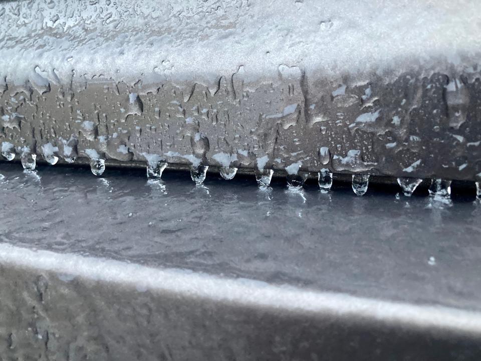 Ice accumulates on the back of a car in Jacksonville before sunset Friday.