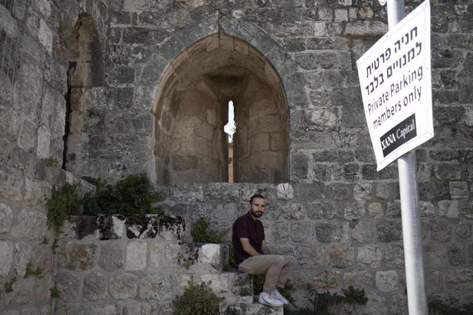 Community leader Hagop Djernazian poses for a portrait on the edge of a parking lot that is part of a contentious lease deal in the Armenian Quarter in the Old City of Jerusalem, Tuesday, May 30, 2023. "This quarter is everything to me. It's the only place we have for Armenians to gather in the Holy Land," he says. "We have to fight for it." (AP Photo/ Maya Alleruzzo)