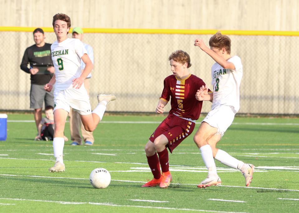 Cardinal Spellman's Caleb Green fights for the ball in a game against Bishop Feehan at Cardinal Spellman High School on Wednesday, October 20, 2021.