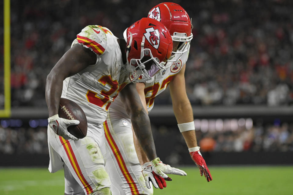 Kansas City Chiefs running back Darrel Williams, left, celebrates after scoring a touchdown against the Las Vegas Raiders during the second half of an NFL football game, Sunday, Nov. 14, 2021, in Las Vegas. (AP Photo/David Becker)