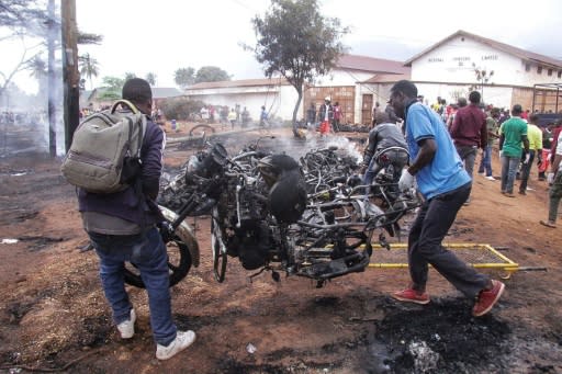 Footage from the crash scene showed the truck engulfed in fierce flames and huge clouds of smoke, with charred bodies among the burnt-out remains of motorcycle taxis