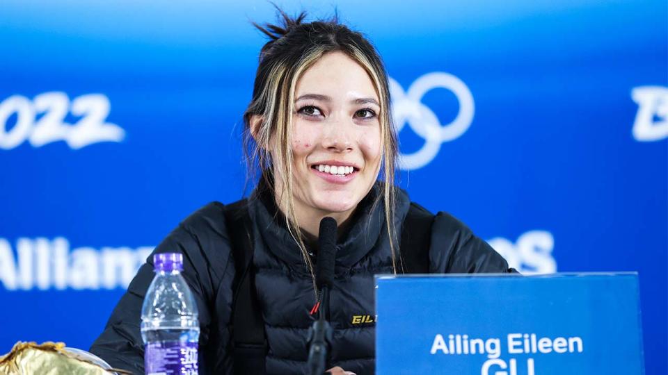 Winter Olympics gold medallist Eileen Gu (pictured) smiles while speaking to the media.