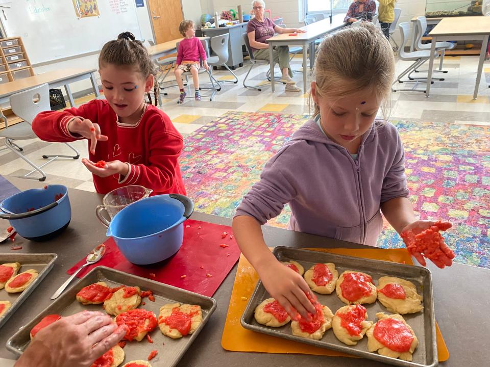 First grade students at Isaac Dickson making pan dulce. (McKenna Leavens Photo | Citizen Times)