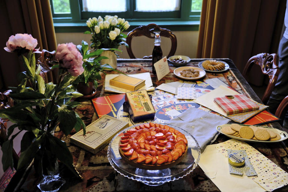 A table is decorated with replicas of gifts Anne Frank received for her 13th birthday - including her first diary - during an event at her family's former apartment in Amsterdam to mark what would have been the teenage Jewish diarist's 90th birthday June 12, 2019. On the day Anne Frank would have turned 90, the museum dedicated to keeping alive her story has brought together schoolchildren and two of the Jewish diarist's friends at the apartment where she lived with her family before going into hiding from Nazis who occupied the Netherlands during World War II. (AP Photo/Michael C. Corder)