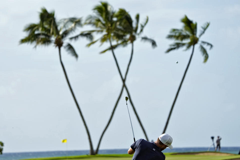 Chris Kirk hits from the 16th fairway during the first round of the Sony Open golf event, Thursday, Jan. 11, 2024, at Waialae Country Club in Honolulu. (AP Photo/Matt York)