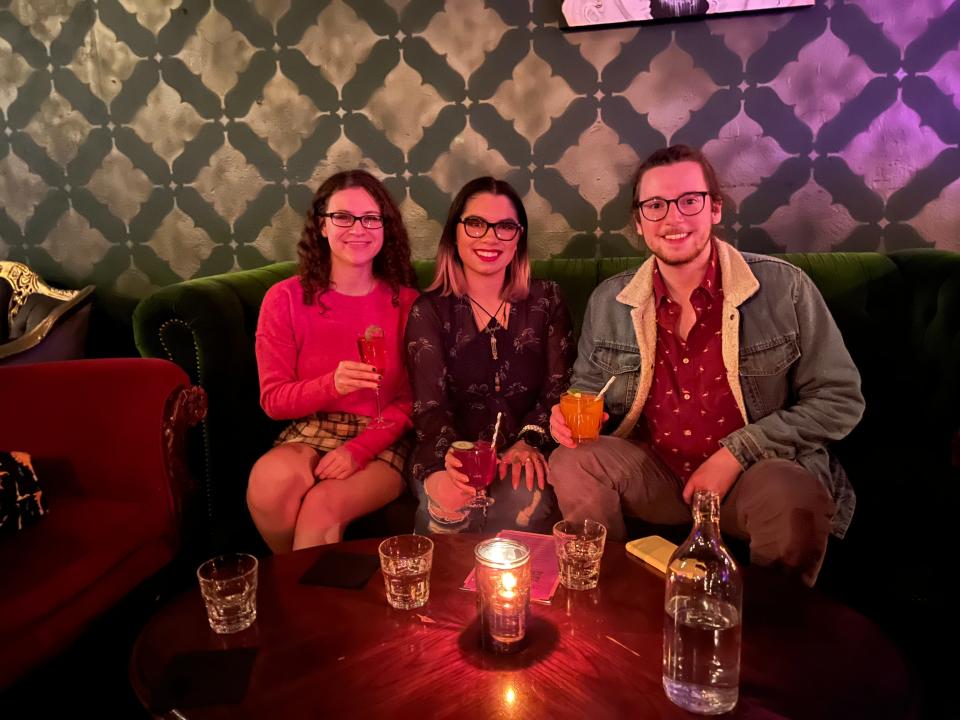 Rebecca and hr friends posing for a photo with their drinks from velveteen rabbit in las vegas