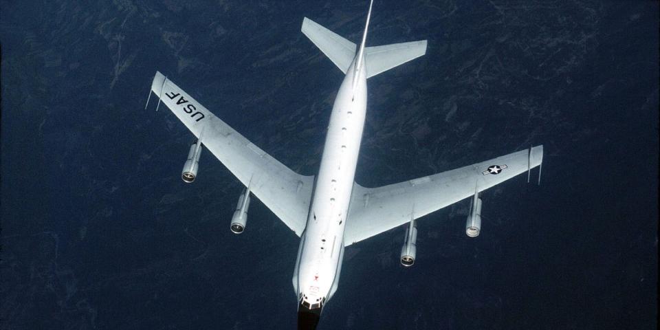 top-level view of spy plane flying over water