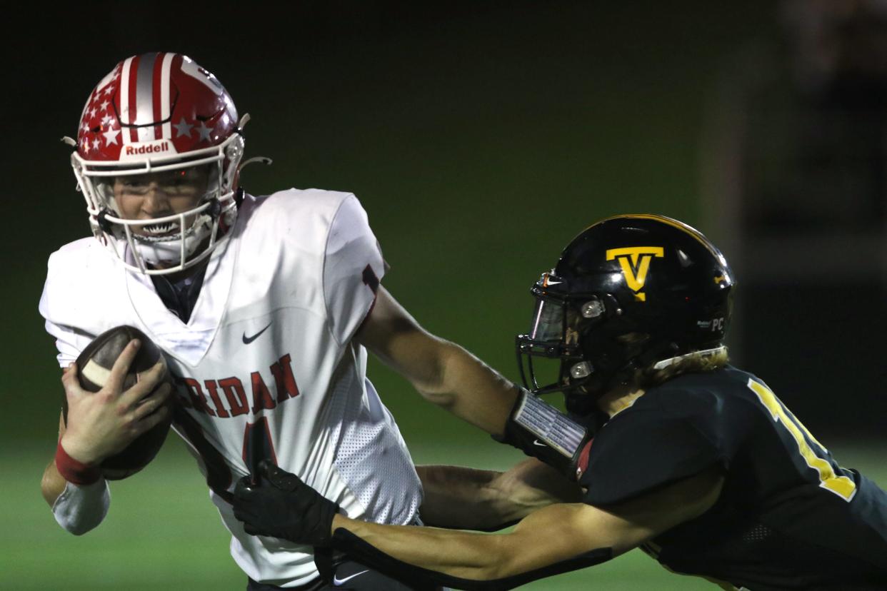 Sheridan's Reid Packer tries to brush off a Tri-Valley defender.