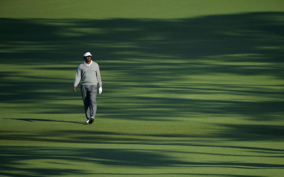 Former Masters champion Vijay Singh of Fiji walks up the second fairway during the second round of the Masters golf tournament at the Augusta National Golf Club in Augusta, Georgia April 11, 2014. REUTERS/Brian Snyder (UNITED STATES - Tags: SPORT GOLF)