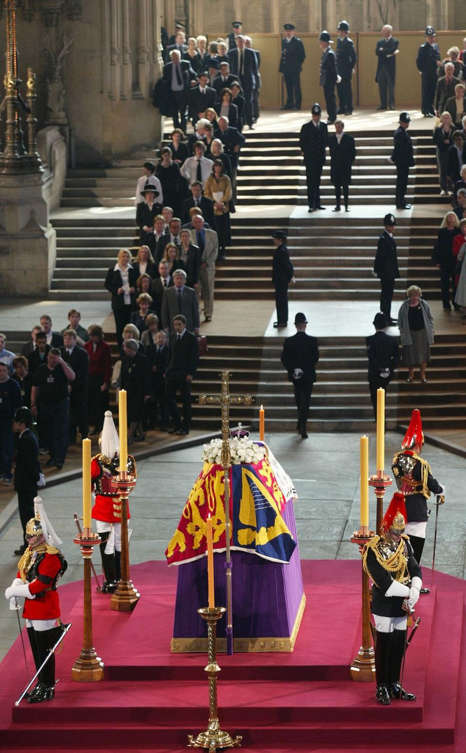Crowds of mourners queue to file past the coffin of the Queen Mother in 2002 (Phil Noble/PA) (PA Archive)