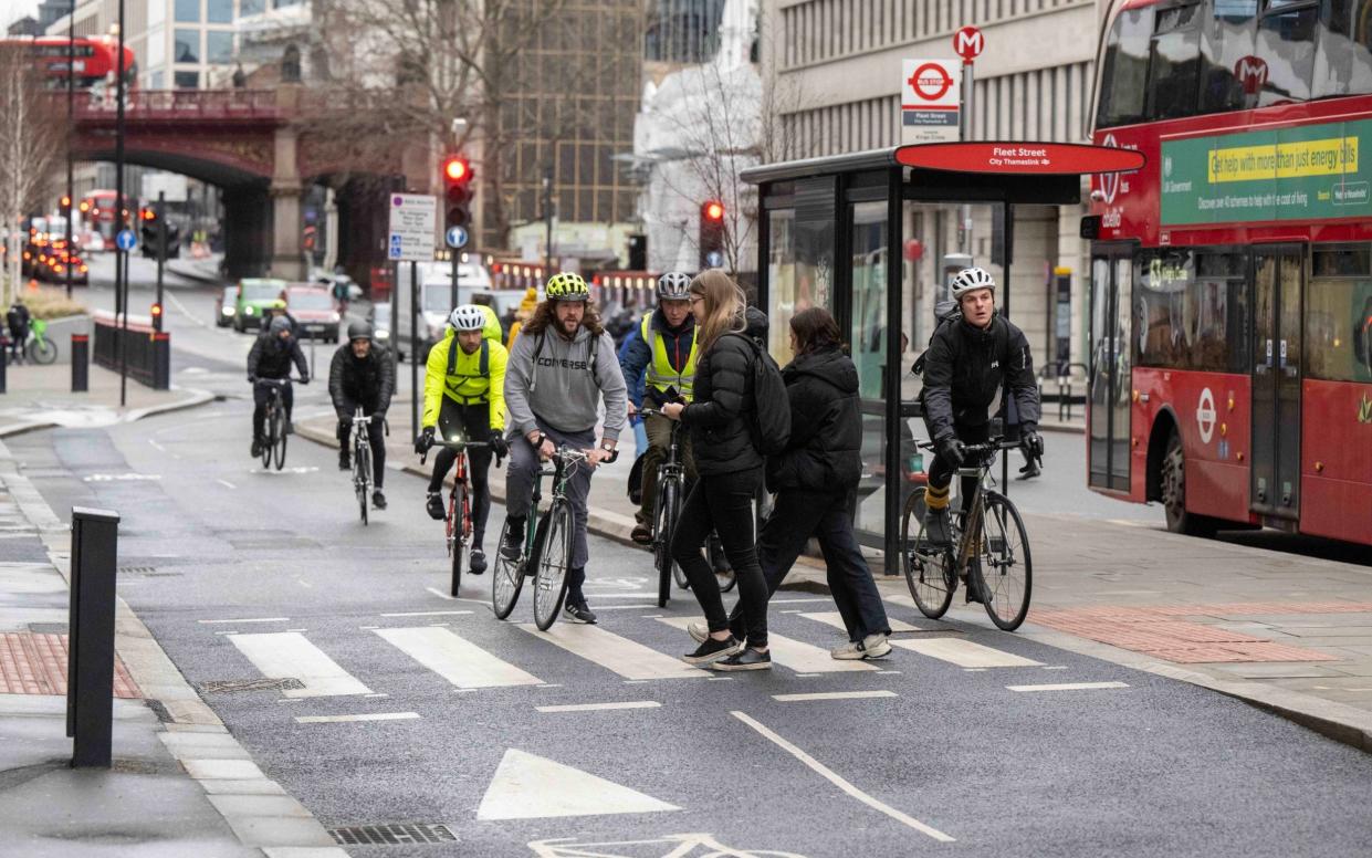 Cyclists on a zebra crossing as pedestrians try to cross - Paul Grover for The Telegraph