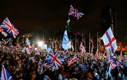 Thousands of people waving Union Jack flags packed Parliament Square in London Saturday to herald Brexit