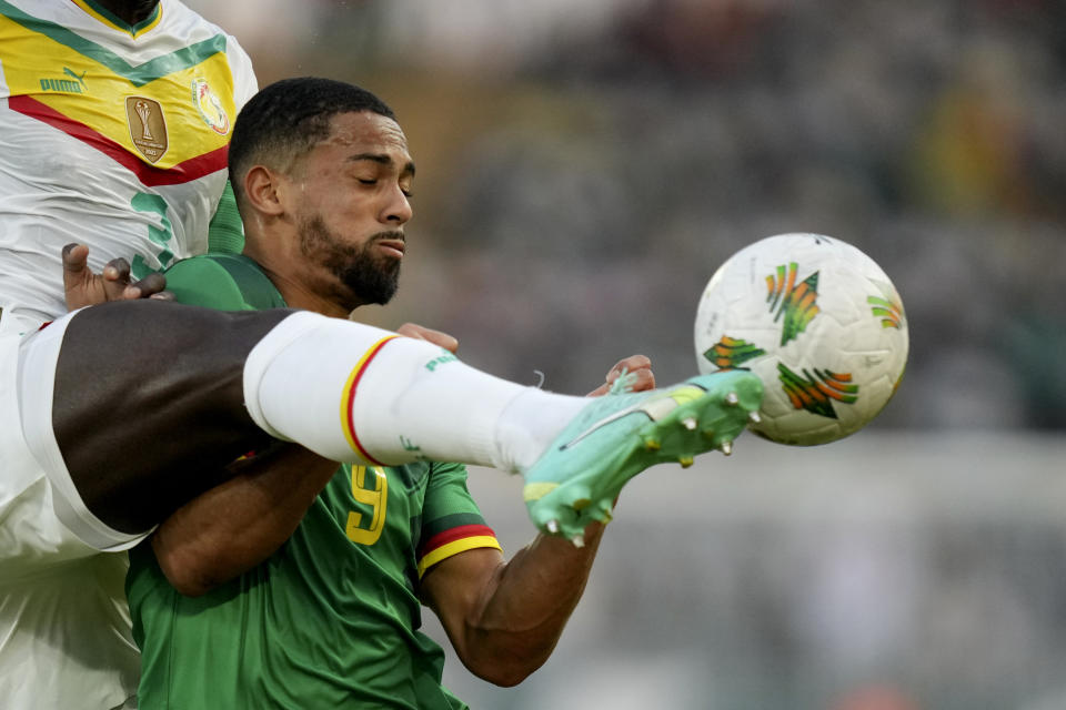 Cameroon's Frank Magri is challenged by Senegal's Kalidou Koulibaly during the African Cup of Nations Group C soccer match between Senegal and Cameroon, at the Charles Konan Banny stadium in Yamoussoukro, Ivory Coast, Friday, Jan. 19, 2024. (AP Photo/Sunday Alamba)