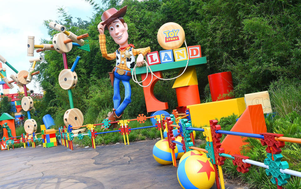 Woody welcomes fans to Toy Story Land, which is full of details from the movies. For example, the yellow ball with a blue stripe and red star is a classic staple of "Toy Story" and Pixar.