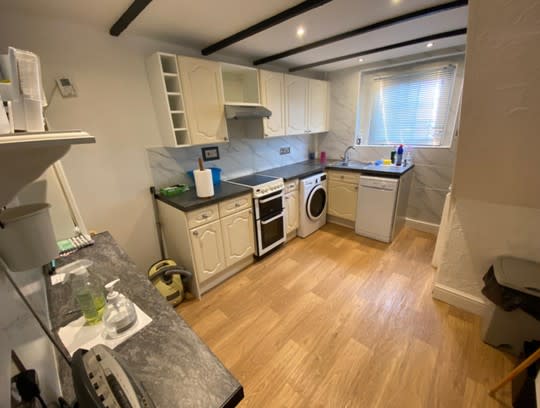 The cosy kitchen has a wood-burning stove. (247Property/APEX)