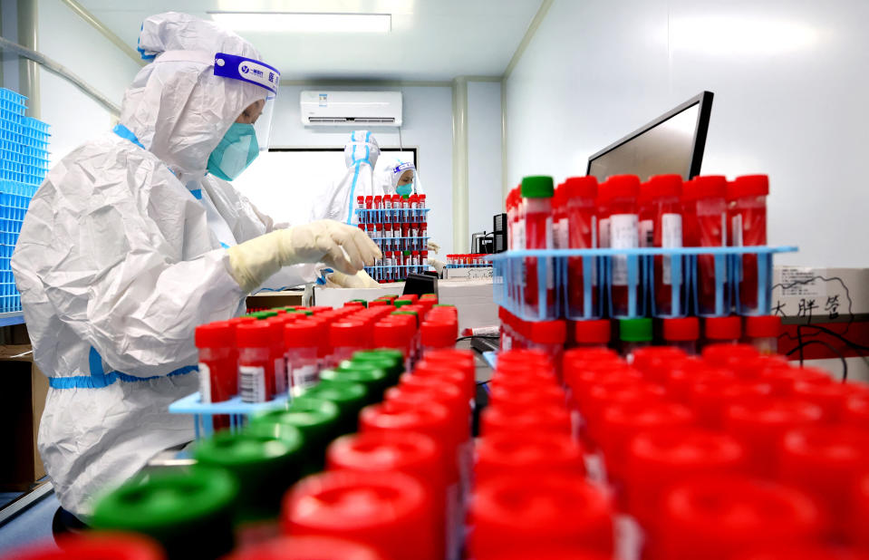 A laboratory technician works at a Covid-19 testing facility in Lianyungang in China’s eastern Jiangsu province. Image: STR/AFP via Getty