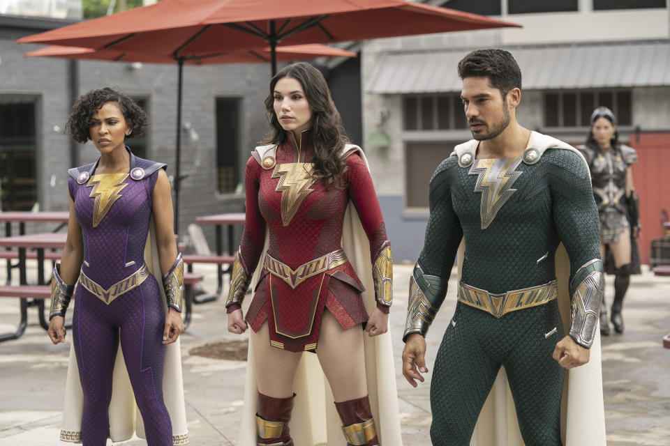 This image released by Warner Bros. Pictures shows Grace Caroline Currey, center, Meagan Good, left, and D.J. Cotrona in a scene from "Shazam! Fury of the Gods." (Warner Bros. Pictures via AP)
