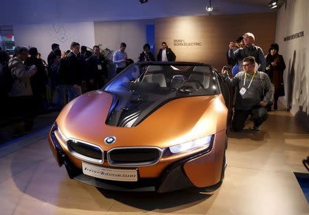 People look over the BMW i Vision Future Interaction concept car during the 2016 CES trade show in Las Vegas, Nevada January 7, 2016. REUTERS/Steve Marcus