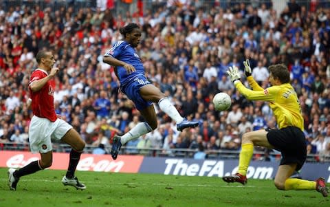  Didier Drogba of Chelsea beats Edwin Van der Sar of Manchester United to score their first goal during the FA Cup Final match sponsored by E.ON between Manchester United and Chelsea at Wembley Stadium - Credit: Shaun Botterill/Getty Images