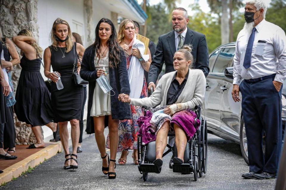 Tayler Scheinhaus holds hands with her mother, Angela Gonzalez, as they arrive for the funeral services for Edgar Gonzalez, Angela’s husband and Tayler’s stepfather, at Christ Fellowship Church in Palmetto Bay on Friday, July 23, 2021. Edgar Gonzalez died during the June 24, 2021, collapse of the 12-story oceanfront condo, Champlain Towers South in Surfside. Angela fell from the ninth to fifth floor in the collapse. Tayler had left the condo about two hours before the collapse.