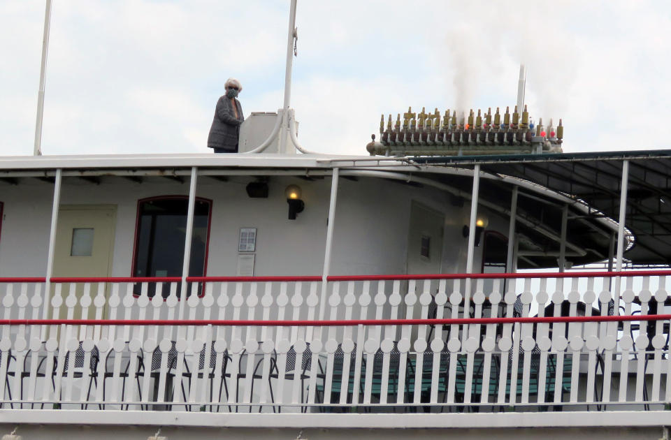 Debbie Fagnano, the calliope player for the riverboat Natchez, plays a 15-minute hymn and gospel medley, Friday, April 3, 2020 as a tribute to jazz pianist and educator Ellis Marsalis, who died Wednesday of pneumonia brought on by COVID-19. A steamboat company spokeswoman said that since the calliope carries a long way, the Natchez may play brief concerts on Friday as morale-boosters. (AP Photo/Janet McConnaughey)