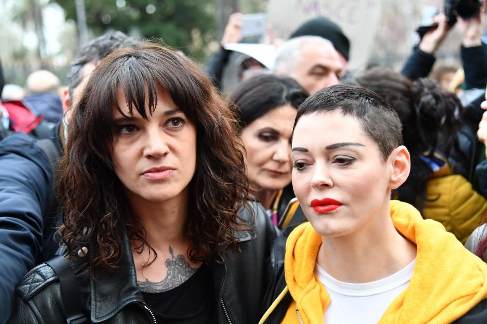 Italian actress Asia Argento (L) and US singer and actress Rose McGowan, who both accuse Harvey Weinstein of sexual assault, take part in a march organised on International Women's DayAFP via Getty Images