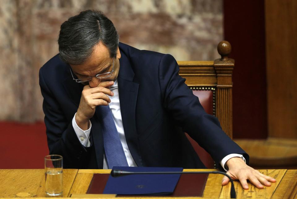 Greek Prime Minister Antonis Samaras reacts in parliament during the last round of a presidential vote in Athens December 29, 2014. Greek Prime Minister Samaras said he would propose holding an early national election on Jan. 25 after parliament rejected his nominee for president. REUTERS/Yannis Behrakis (GREECE - Tags: POLITICS ELECTIONS TPX IMAGES OF THE DAY)