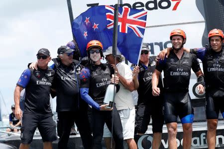 Sailing - America's Cup finals - Hamilton, Bermuda - June 26, 2017 - Peter Burling, Emirates Team New Zealand Helmsman celebrates with his team after defeating Oracle Team USA in race nine to win the America's Cup. REUTERS/Mike Segar