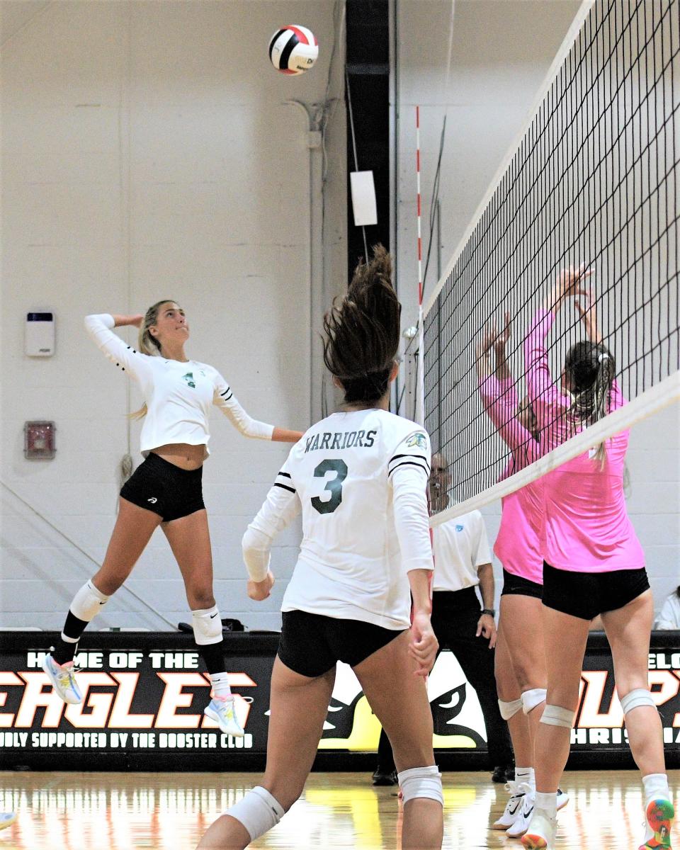 Jupiter's Sarah Brodner rises for a slam at the net in a game against Jupiter Christian (Aug. 22, 2023).