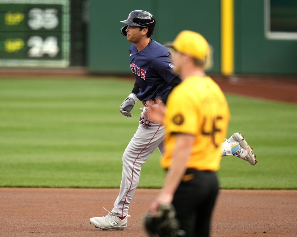 Boston Red Sox's Triston Casas, left, rounds first base after hitting a solo home run off Pittsburgh Pirates starting pitcher Quinn Priester, right, during the first inning of a baseball game in Pittsburgh, Friday, April 19, 2024. (AP Photo/Gene J. Puskar)
