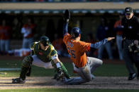 Oakland Athletics catcher Sean Murphy, left, tags out Houston Astros' Jose Siri (26) in the ninth inning of a baseball game in Oakland, Calif., Sunday, Sept. 26, 2021. (AP Photo/John Hefti)