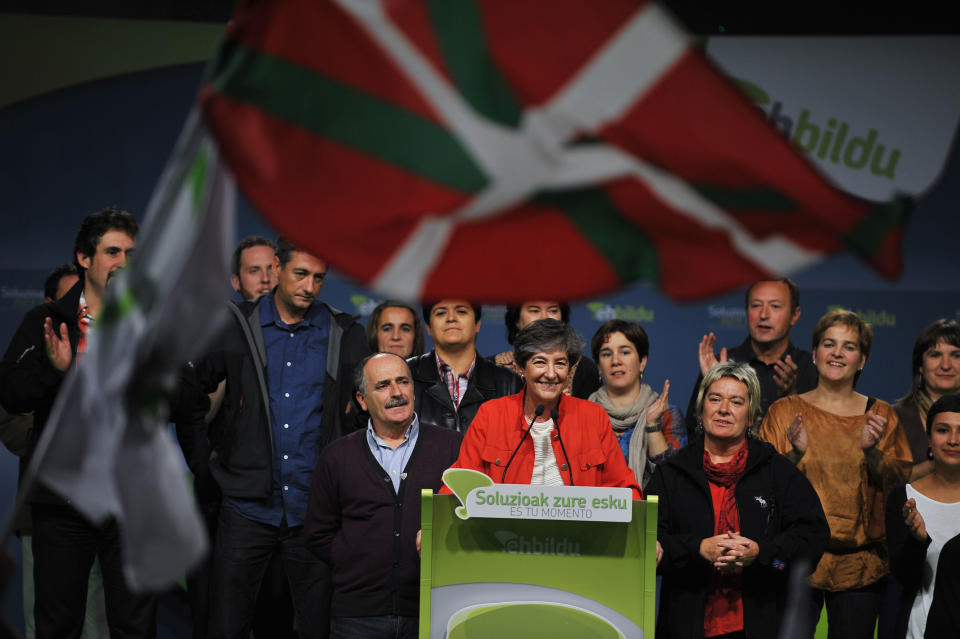 Laura Mintegi, center, leader of Euskal Herria Bildu, the new pro independence Basque Party, celebrates with supporters in Bilbao, northern Spain, Sunday Oct. 21, 2012. Almost 4.5 million people went to the polls Sunday in regional elections in Spain's turbulent Basque region and in northwestern Galicia. In the Basque region the Basque Nationalist Party _ PNV _ took 27 seats while the separatist Bildu party claimed 21, giving pro-independence candidates their second-largest majority in 34 years of democracy. (AP Photo/Alvaro Barrientos)